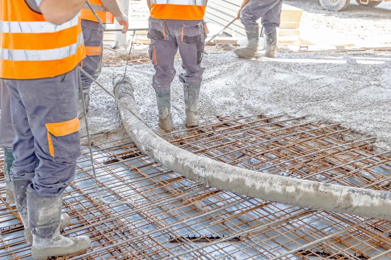 Floor screed being pumped and levelled in Brighton